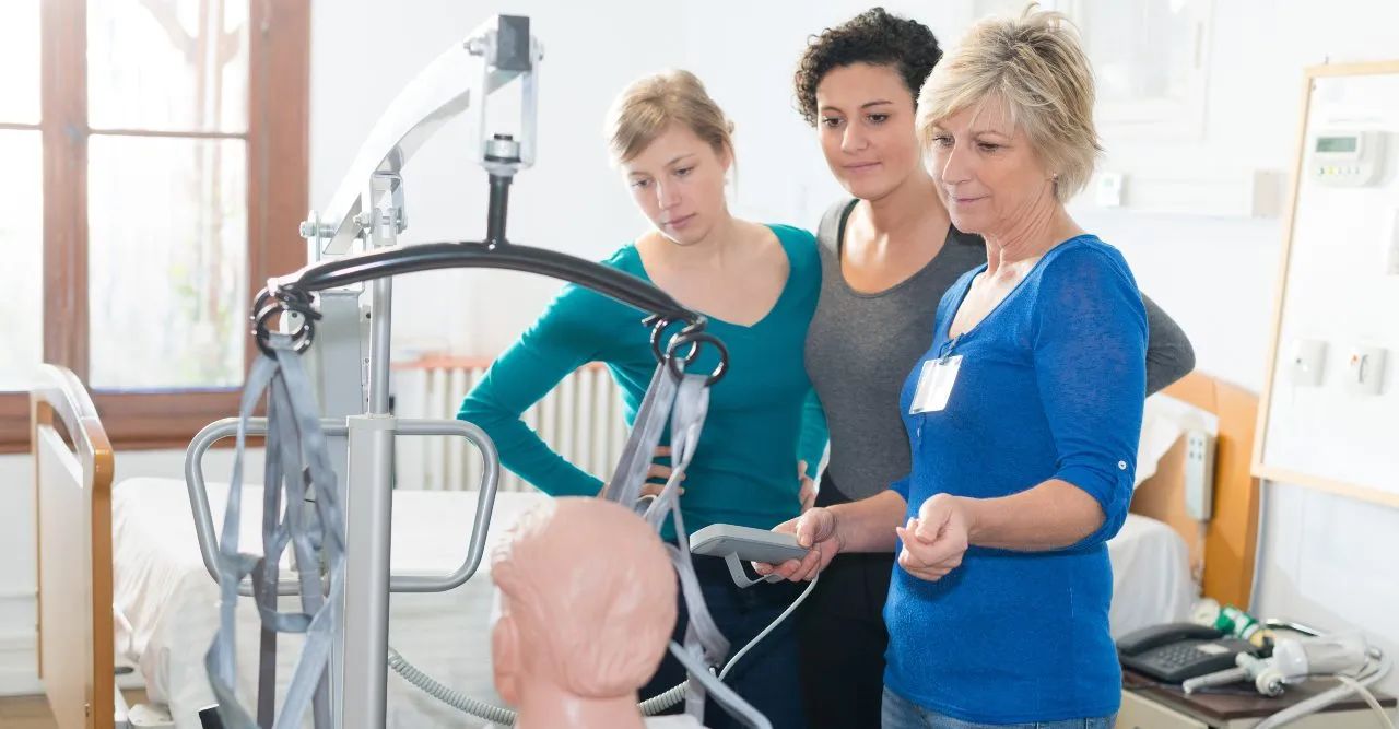 nurses using a lift with the proper amount of staff present